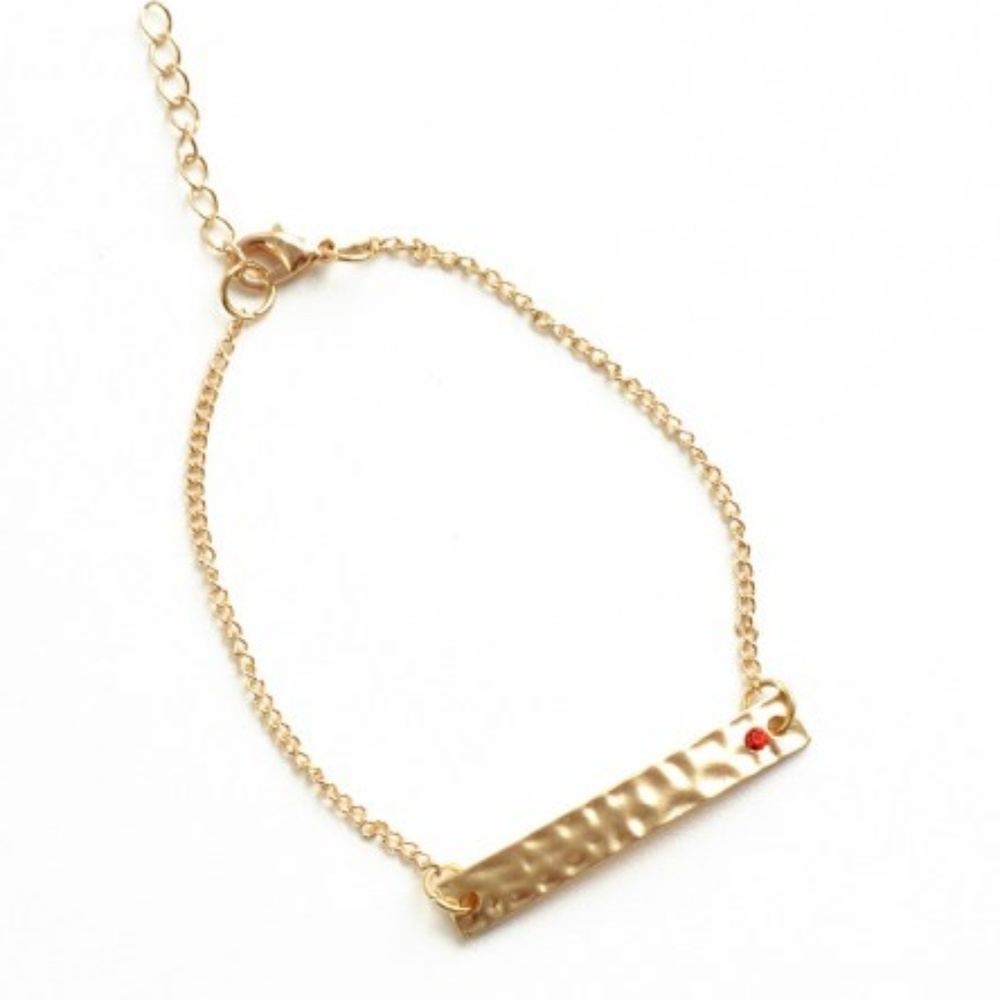 Gold Om Bracelet with Red Siam Crystal